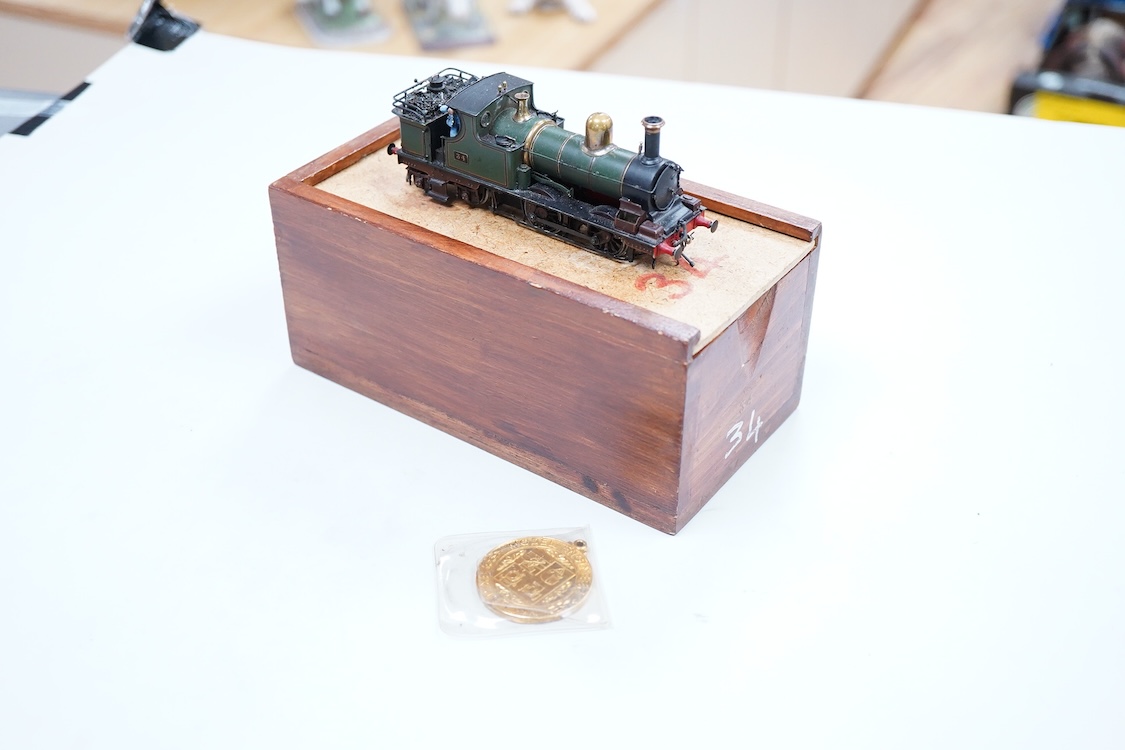 A narrow gauge scratch built model railway locomotive running on 32mm track by John Worsley, a Ruston 0-4-0 diesel shunter, 7, a detailed model with sprung buffers, etc. and fitted with a Mashima 12v dc motor, for two ra
